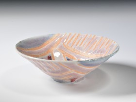 1986. Wax resist decoration, copper-red glaze. Reduction fired. Cone 9