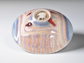 1986. Wax resist decoration, copper-red glaze. Reduction fired. Cone 9