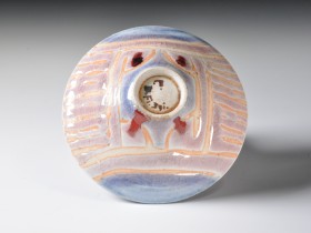 1986. Wax resist decoration, copper-red glaze. Reduction fired. Cone 9